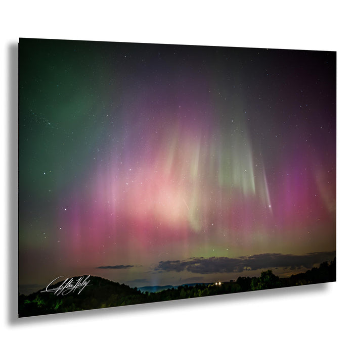 a stunning night sky filled with vibrant colors and patterns, including the mesmerizing aurora borealis or northern lights.