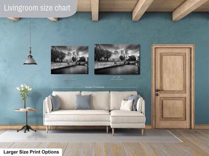 a living room with a white sofa, a wooden door, and a painting of a cityscape on the wall.