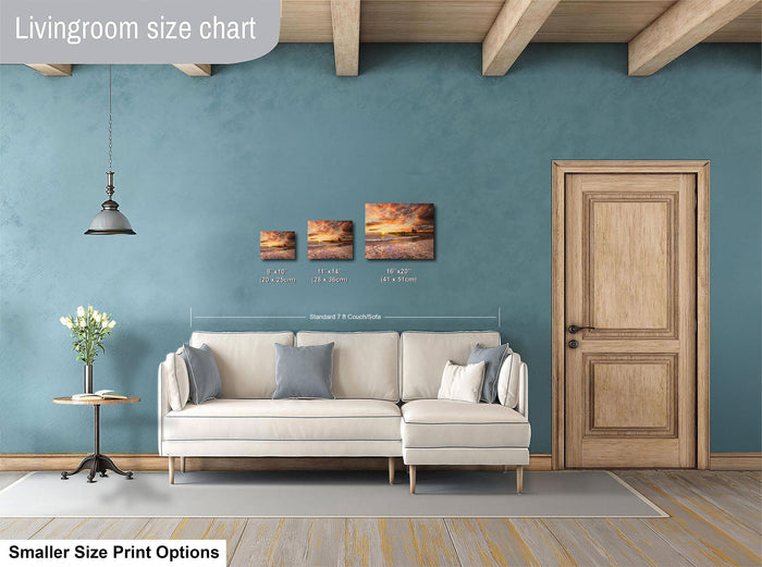 a living room with a white sofa, a wooden door, and a painting on the wall. The living room appears to be modern and spacious, with a blue wall and wooden beams on the ceiling.