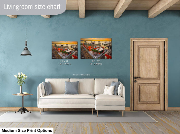 a living room with a white sofa, a wooden door, and a painting hanging on the wall. The painting is of a cityscape, and the sofa is positioned in front of it. The living room appears to be well-lit and decorated with various elements, such as a potted plant and a vase.