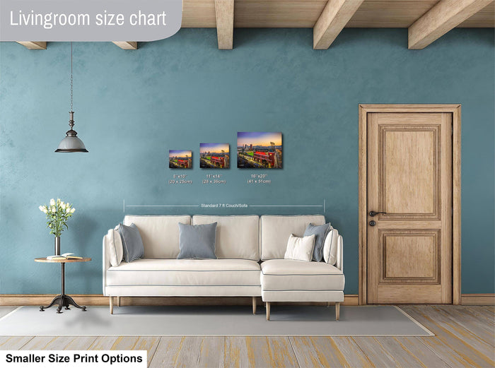 The image is a living room with a white sofa, a wooden door, and a hanging light fixture. There are three framed artworks displayed on the wall, each with different sizes and dimensions. The living room appears to be well-decorated and spacious.