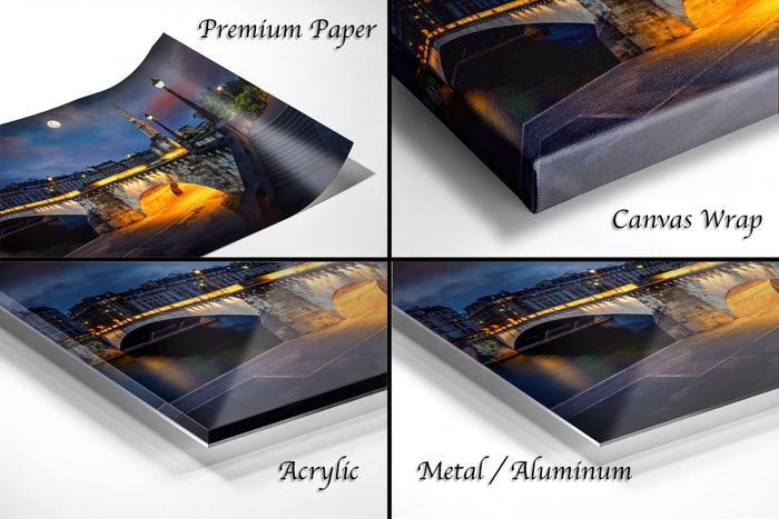 The image is a collage of four different views of a bridge at night, with the bridge illuminated by lights. The collage is labeled as "Premium Paper", "Canvas Wrap", "Acrylic", and "Metal/Aluminum".