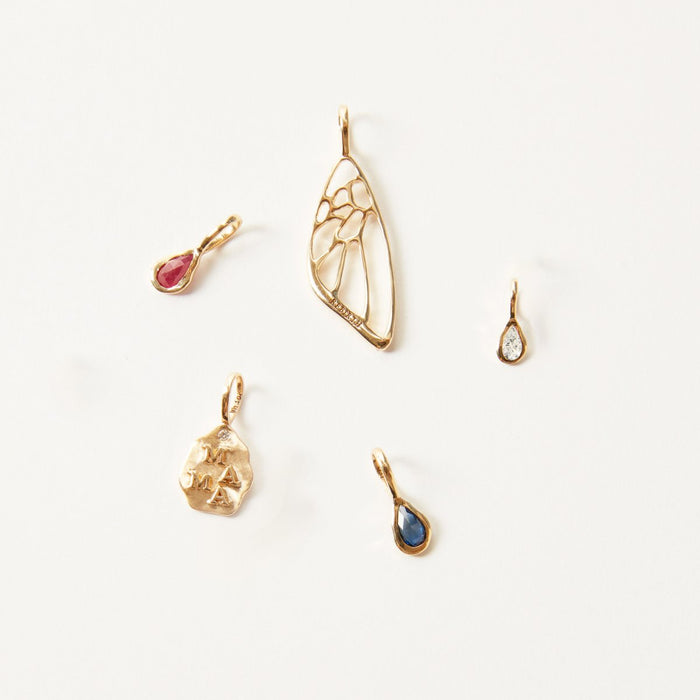 Pear Diamond April Mood Birthstone Charm in 10k yellow gold with diamond, studio detail view