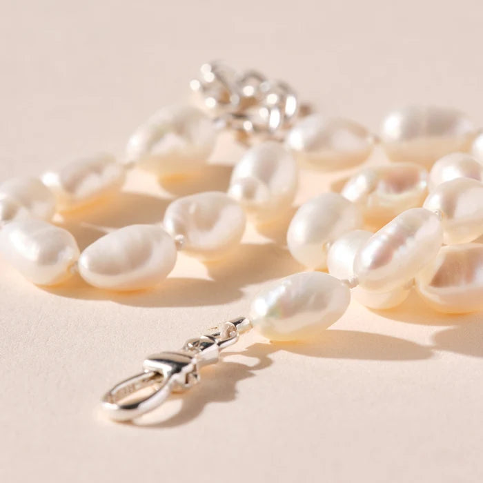 closeup on pearl beaded silver anklet