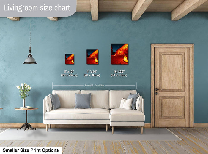 a living room with a white sofa and a wooden door. There are three framed artworks of different sizes displayed on the wall, with the largest one being 16 x 20 inches and the smallest one being 11 x 14 inches. The image also includes a chart that provides the dimensions of the artworks in centimeters.