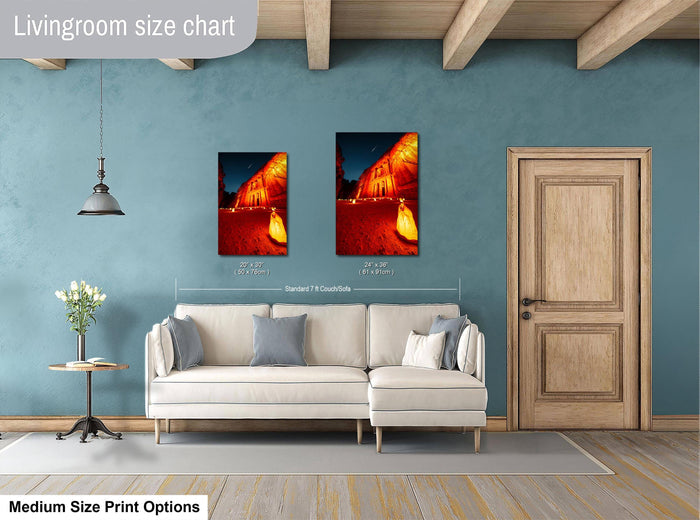 a living room with a white sofa, a wooden door, and a painting of a building with a red roof. The living room has a blue wall and a wooden ceiling.