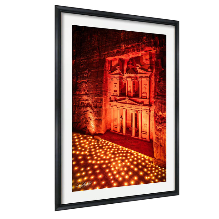 a large, ornate building illuminated by red lights, creating a striking and dramatic scene.