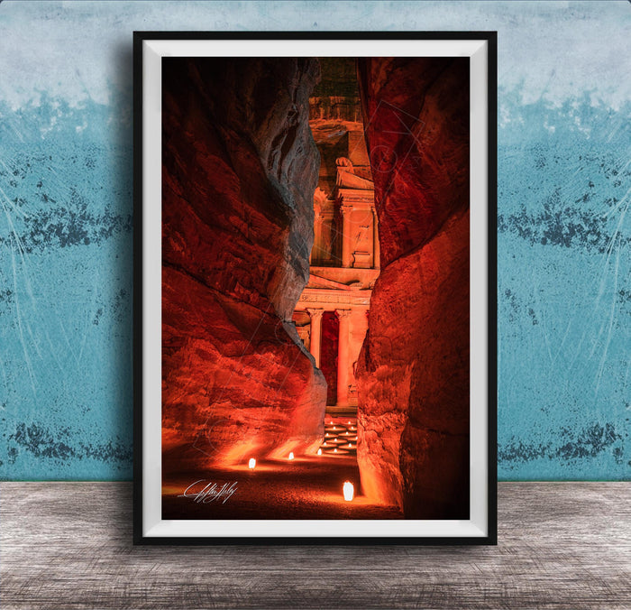 a narrow passage in a cave, with a stone archway leading to a doorway at the end. The passage is illuminated by a warm glow, creating a sense of depth and mystery.