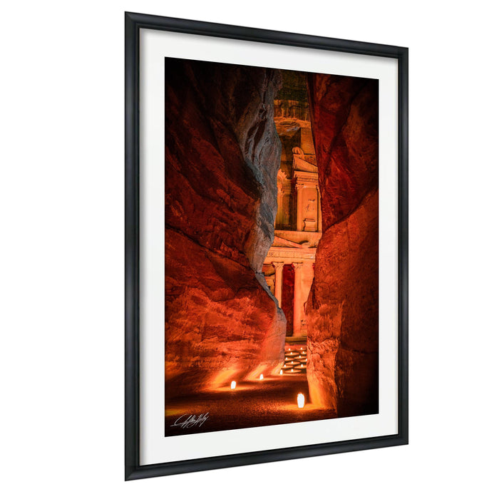 a cave with a carved stone structure, illuminated by warm lighting that creates a cozy and inviting atmosphere.