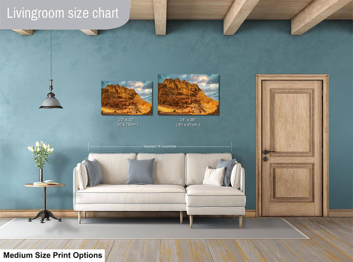 a living room with a white sofa, a wooden door, and a painting of a mountain landscape on the wall. The living room appears to be well-lit and decorated with a modern style.