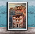 A framed image of the ancient Monastery carved into a cliff face, with a dramatic sky and rocky landscape in the background.