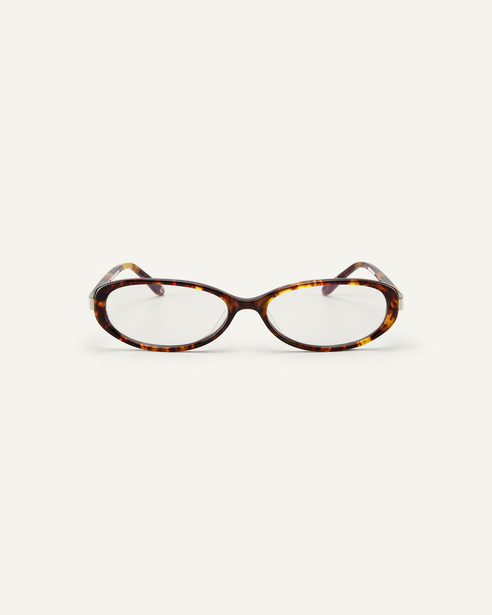Face shot of Bonnie Clyde Pixie optical frames in tortoise with clear lenses.