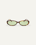 Face shot of Bonnie Clyde Pixie sunglasses in tortoise with green lenses.