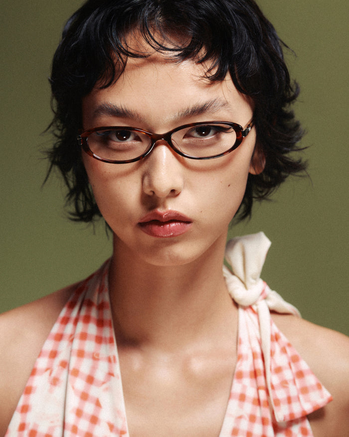 Quarter shot of Bonnie Clyde Pixie optical frames in tortoise with clear lenses.