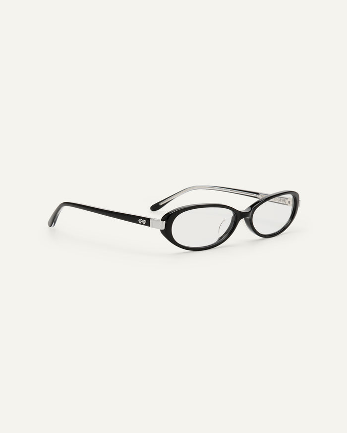 Side shot of Bonnie Clyde Pixie optical frames in black with clear lenses.