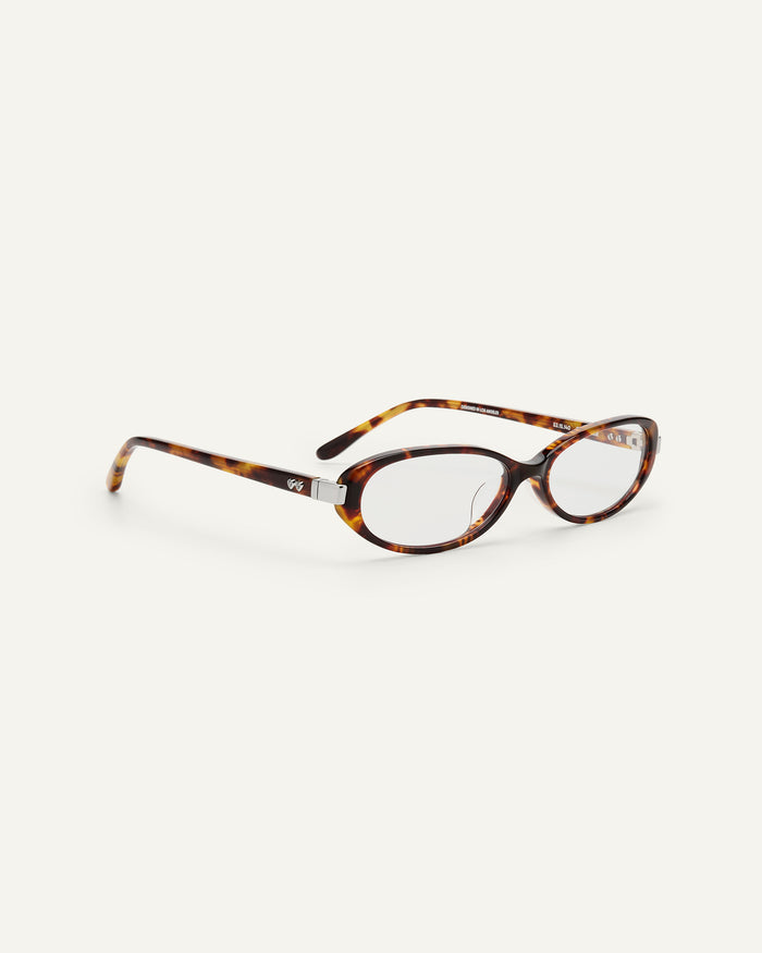 Close-up shot of Bonnie Clyde Pixie optical frames in tortoise with clear lenses.