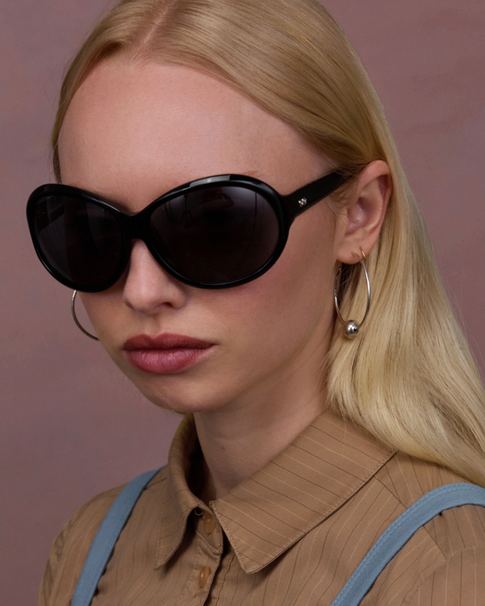Quarter shot of Bonnie Clyde Princessa sunglasses in black with black lenses.
