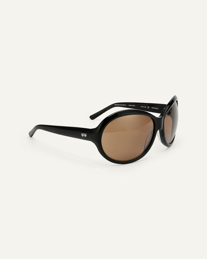 Side shot of Bonnie Clyde Princessa sunglasses in black with brown lenses.