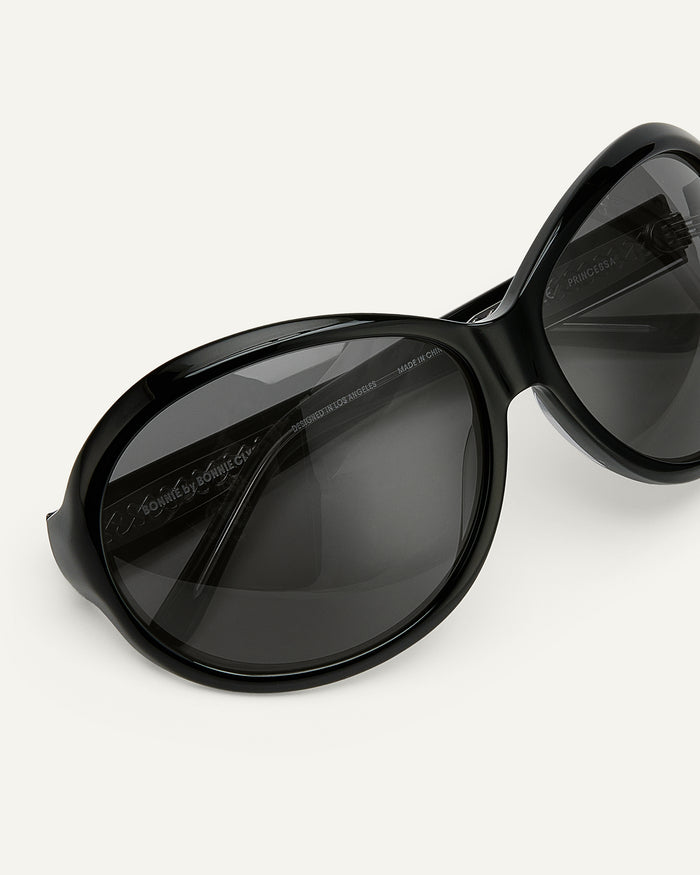 Side shot of Bonnie Clyde Princessa sunglasses in black with black lenses.