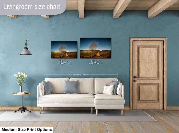 a living room with a white sofa, a wooden door, and a painting of the Great Pyramid of Giza hanging on the wall.