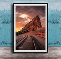 a large, steep rock formation with a dramatic sky in the background, creating a striking and visually appealing scene.