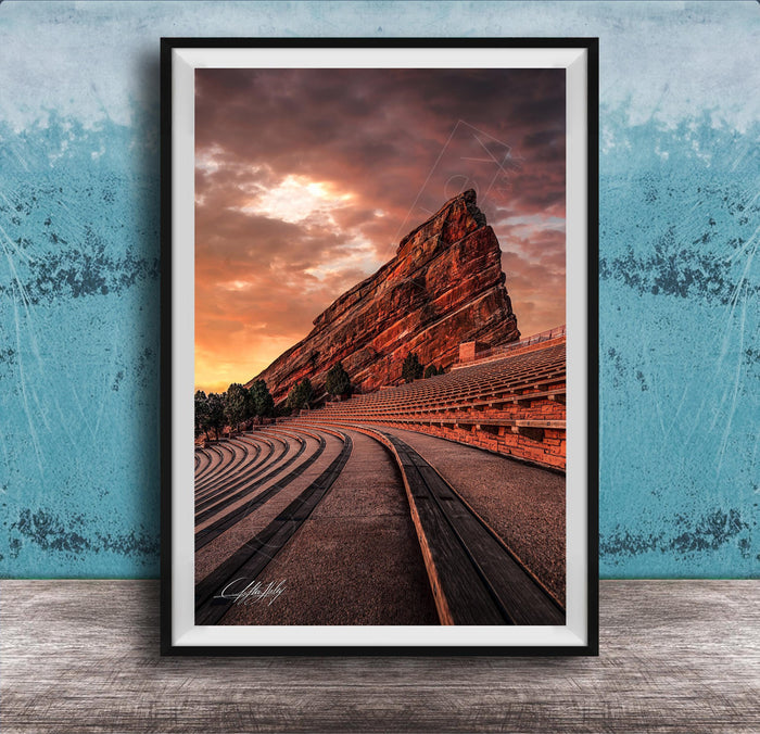 a large, steep rock formation with a dramatic sky in the background, creating a striking and visually appealing scene.