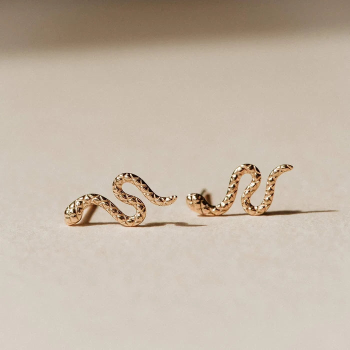 Revival Dainty Snake Earrings in 14k yellow gold, studio detail view