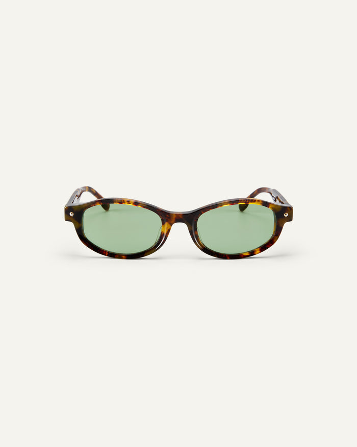 Face shot of Bonnie Clyde Roller Coaster sunglasses in tortoise with green lenses.