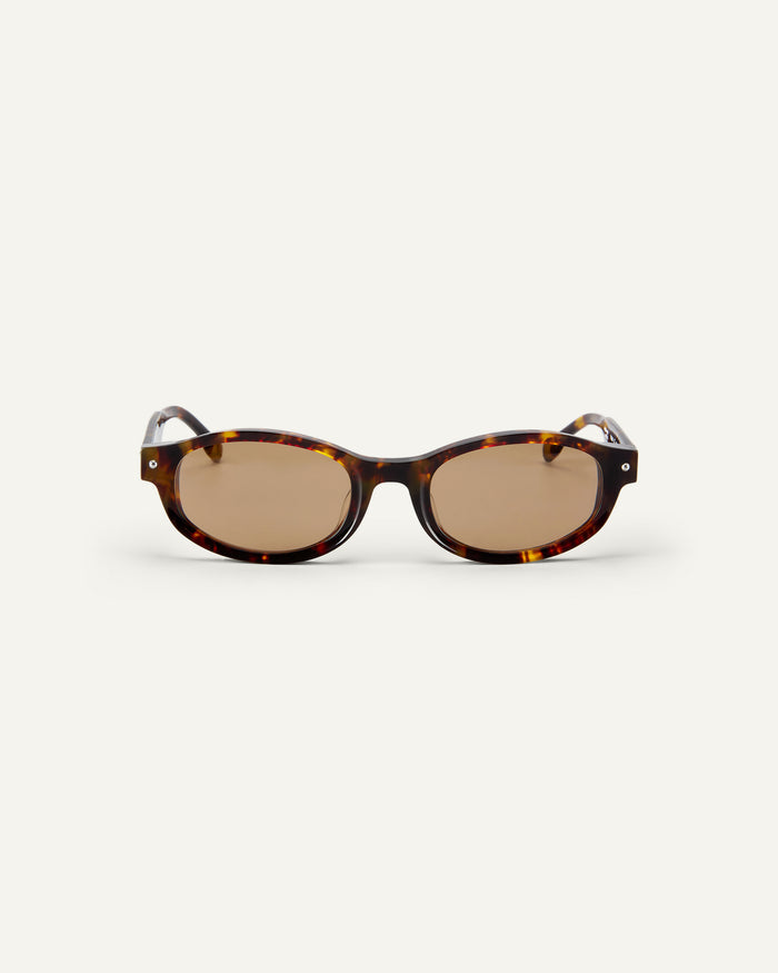 Face shot of Bonnie Clyde Roller Coaster sunglasses in tortoise with brown lenses.