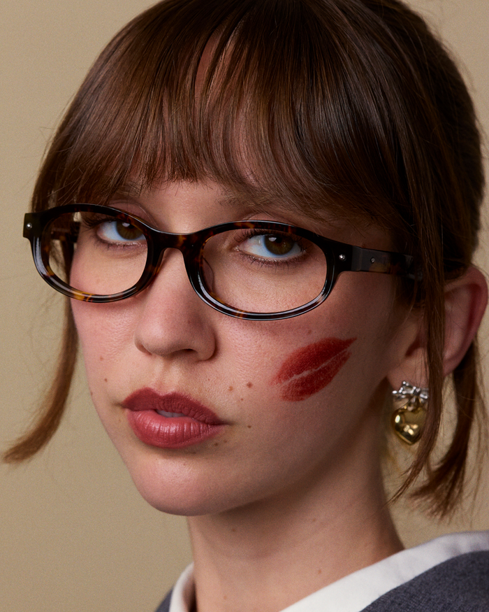 Quarter shot of Bonnie Clyde Roller Coaster optical frames in tortoise with clear lenses.