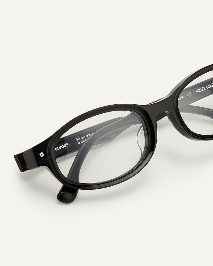 Close-up shot of Bonnie Clyde Roller Coaster optical frames in black with clear lenses.