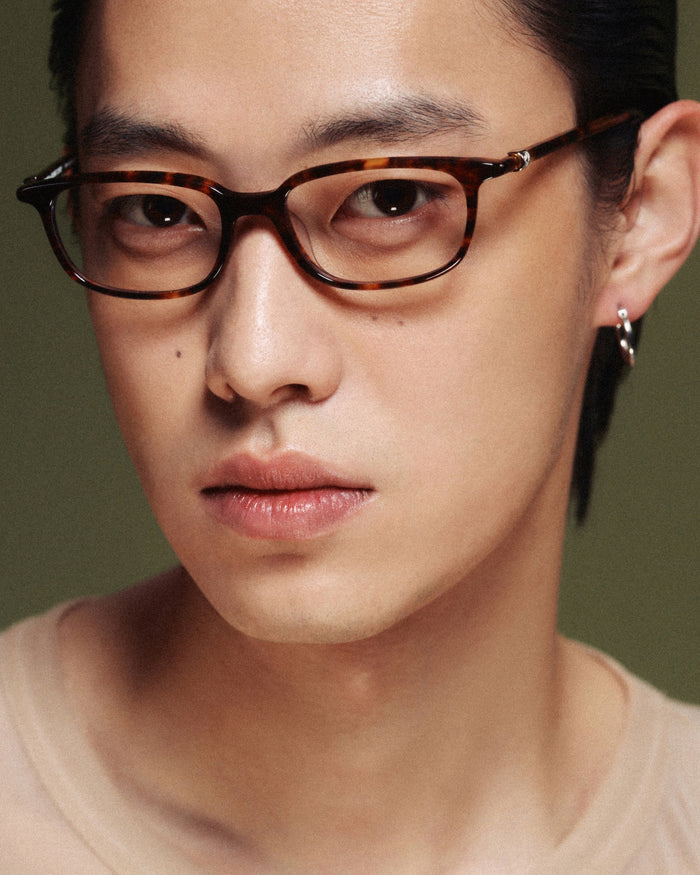 Quarter shot of Bonnie Clyde Rookie optical frames in tortoise with clear lenses.