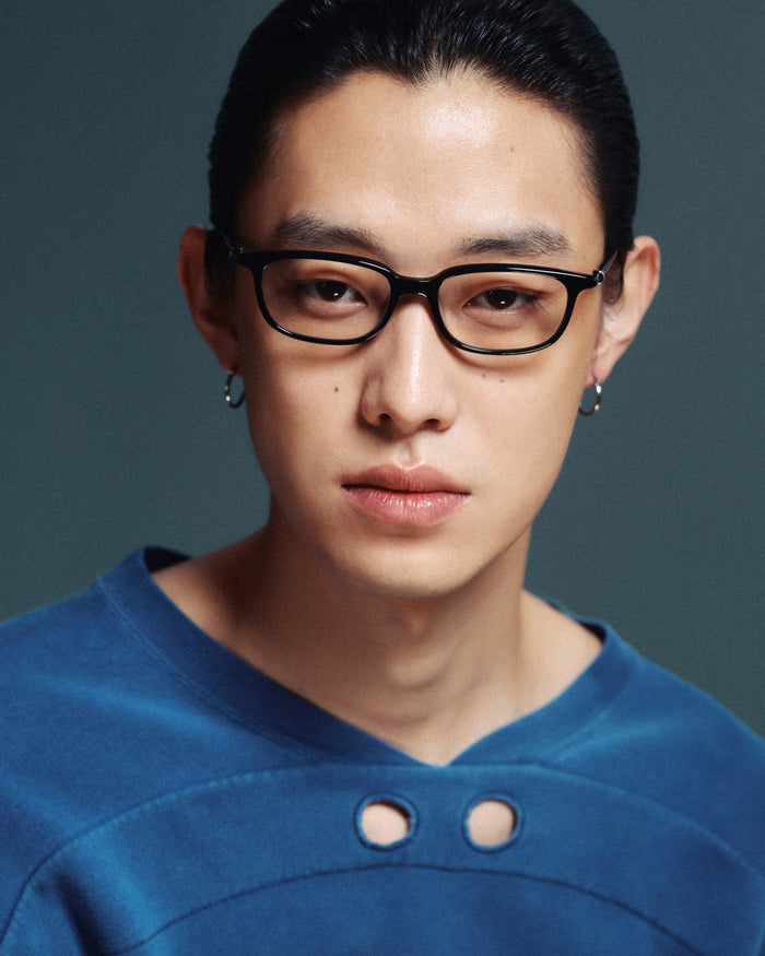 Quarter shot of Bonnie Clyde Rookie optical frames in black with clear lenses.