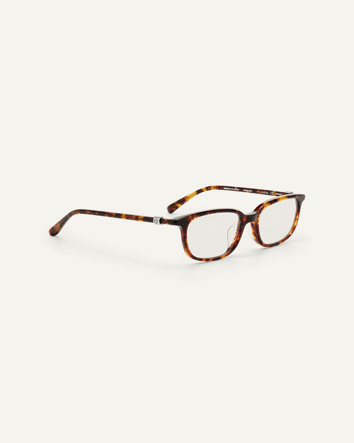 Side shot of Bonnie Clyde Rookie optical frames in tortoise with clear lenses.