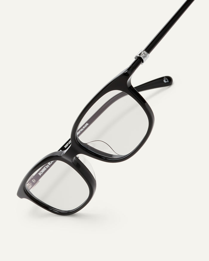 Detail shot of Bonnie Clyde Rookie optical frames in black with clear lenses.