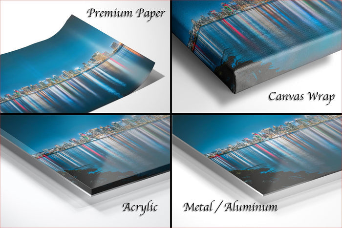 The image is a collage of four different views of a cityscape, each with a distinct perspective and framing. The collage includes a close-up view of the city skyline, a wide-angle view of the city, a close-up view of the city skyline, and a close-up view of the city skyline. The collage is labeled as "Premium Paper", "Canvas Wrap", "Acrylic", and "Metal/Aluminum".