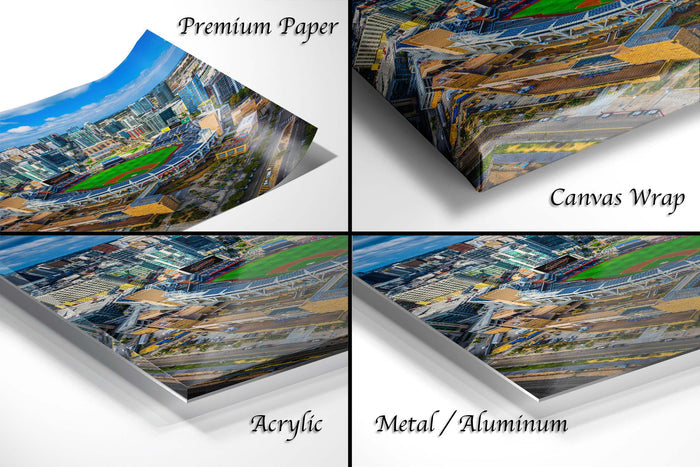 four different views of a cityscape, including a top-down view, a side view, a close-up view, and a bottom-up view. The text labels the different views as "Premium Paper", "Canvas Wrap", "Acrylic", and "Metal/Aluminum".