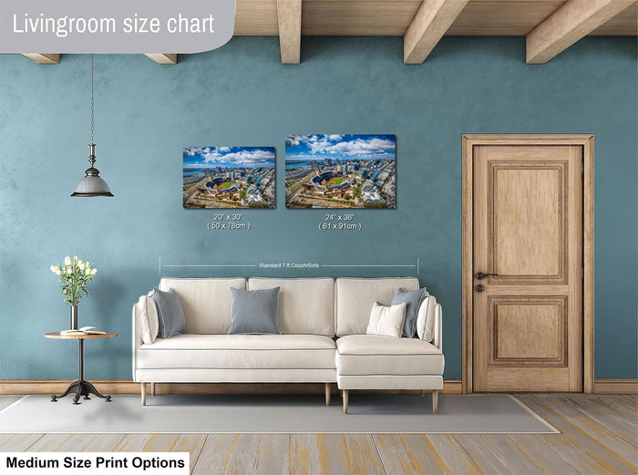 a living room with a white sofa, a wooden door, and a painting of a cityscape on the wall. The living room appears to be well-lit and decorated with a potted plant and a vase.