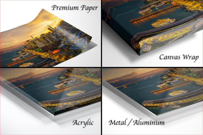 The image is a collage of four different views of a cityscape at sunset, each with a different material or finish, including "Premium Paper", "Canvas Wrap", "Acrylic", and "Metal/Aluminum".