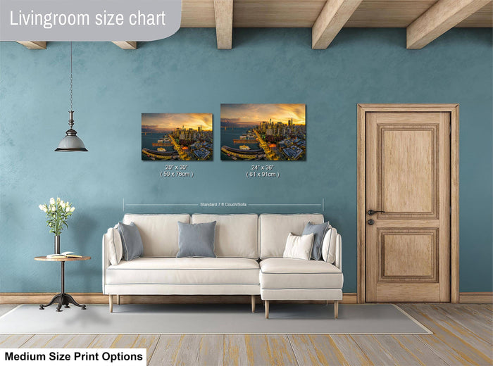 a living room with a white sofa, a wooden door, and a painting of a cityscape on the wall. The painting is of medium size, and the living room appears to be designed for a comfortable and relaxing atmosphere.