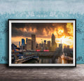 A framed photograph of a city skyline at sunset, with the sun setting behind the buildings and casting a warm, golden glow over the scene.