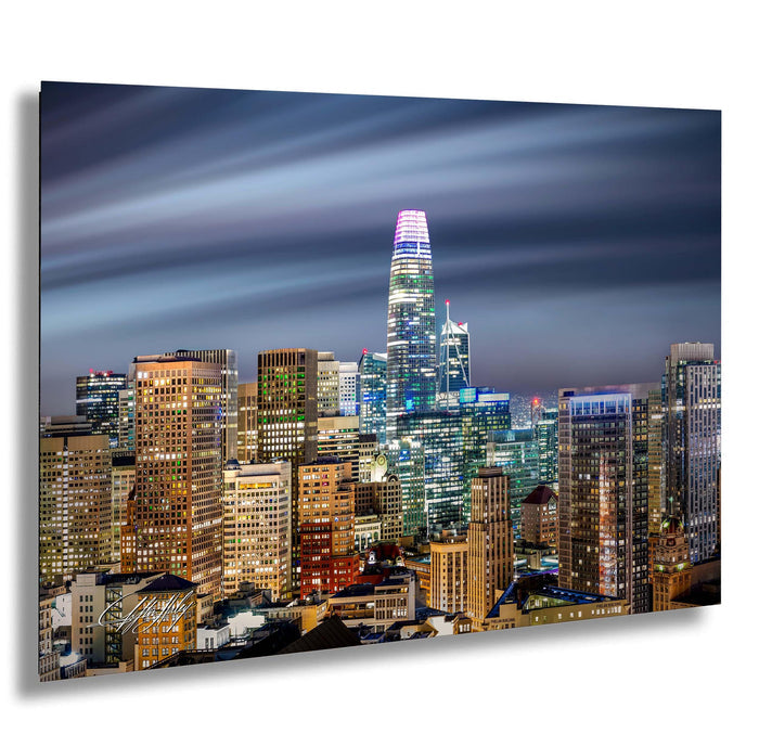 A stunning nighttime cityscape with a towering skyscraper illuminated against the dark sky.