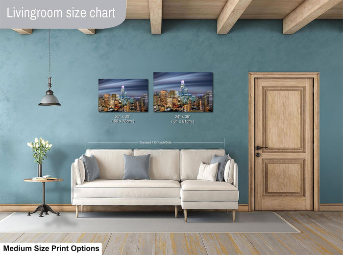a living room with a white sofa, a wooden door, and a painting of a city skyline on the wall. The painting is of a size chart, indicating the dimensions of the artwork in relation to the sofa and door.