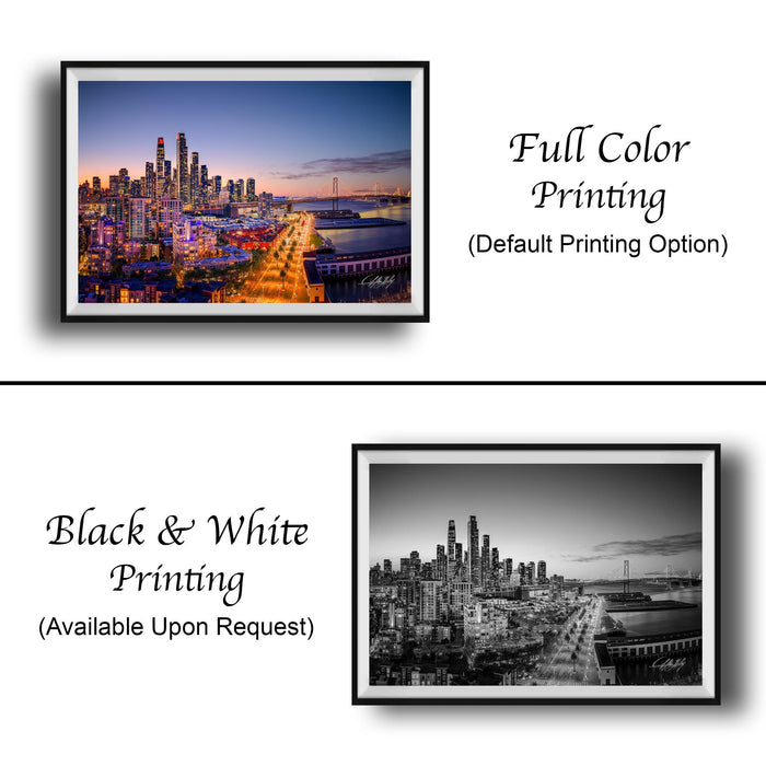 The image is a collage of two framed cityscape photographs. The top photograph is a full-color print of a city skyline at dusk, while the bottom photograph is a black and white print of the same city skyline. Both images are framed and available upon request.