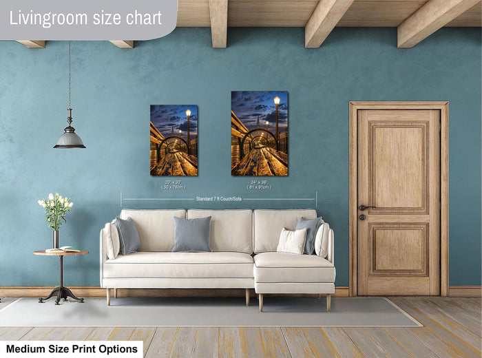 a living room with a white sofa, a wooden door, and a painting of a train on the wall. The painting is of a standard size of 24x36 inches.