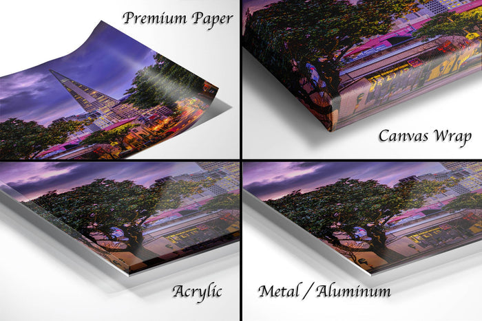 The image is a collage of four different views of a cityscape at sunset, each with a distinct texture and finish. The first image is a printed photograph on premium paper, the second image is a canvas wrap, the third image is an acrylic print, and the fourth image is a metal/aluminum print.