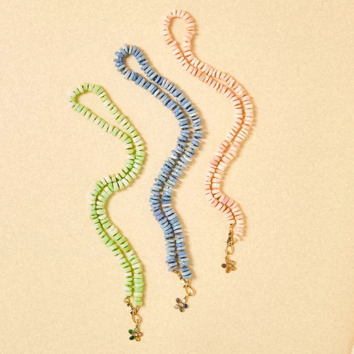 Sunset Forget-me-not Pink Flower Charm in 10k yellow gold, studio detail view