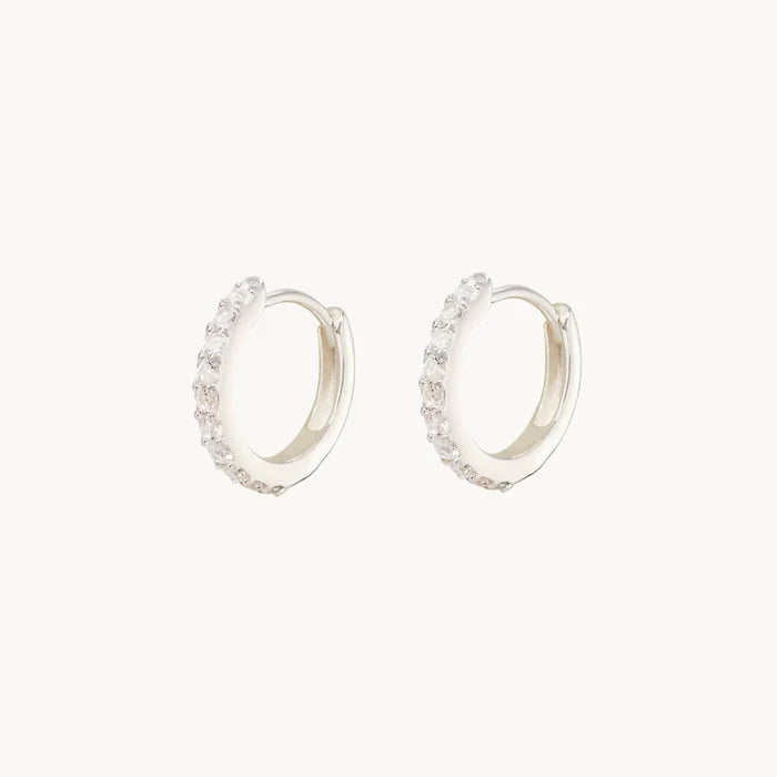 Shine On White Sapphire Huggie Hoops in sterling silver with white sapphires