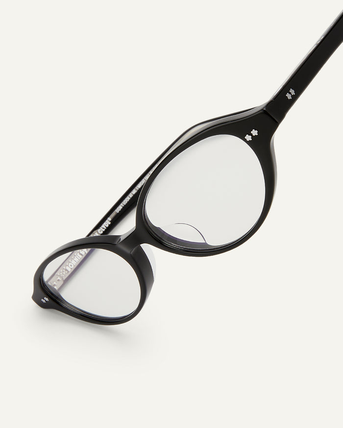 Close-up shot of Bonnie Clyde Small Talk optical frames in black with clear lenses.