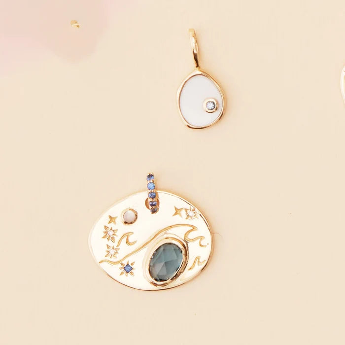 Small Water Element Necklace Charm in 10k yellow gold, studio detail view